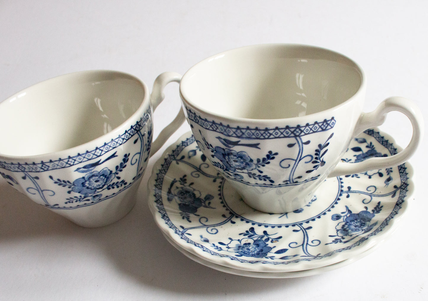 Johnson Brothers 'Indies' Blue and White Transferware Teacups and Sacuers (2)