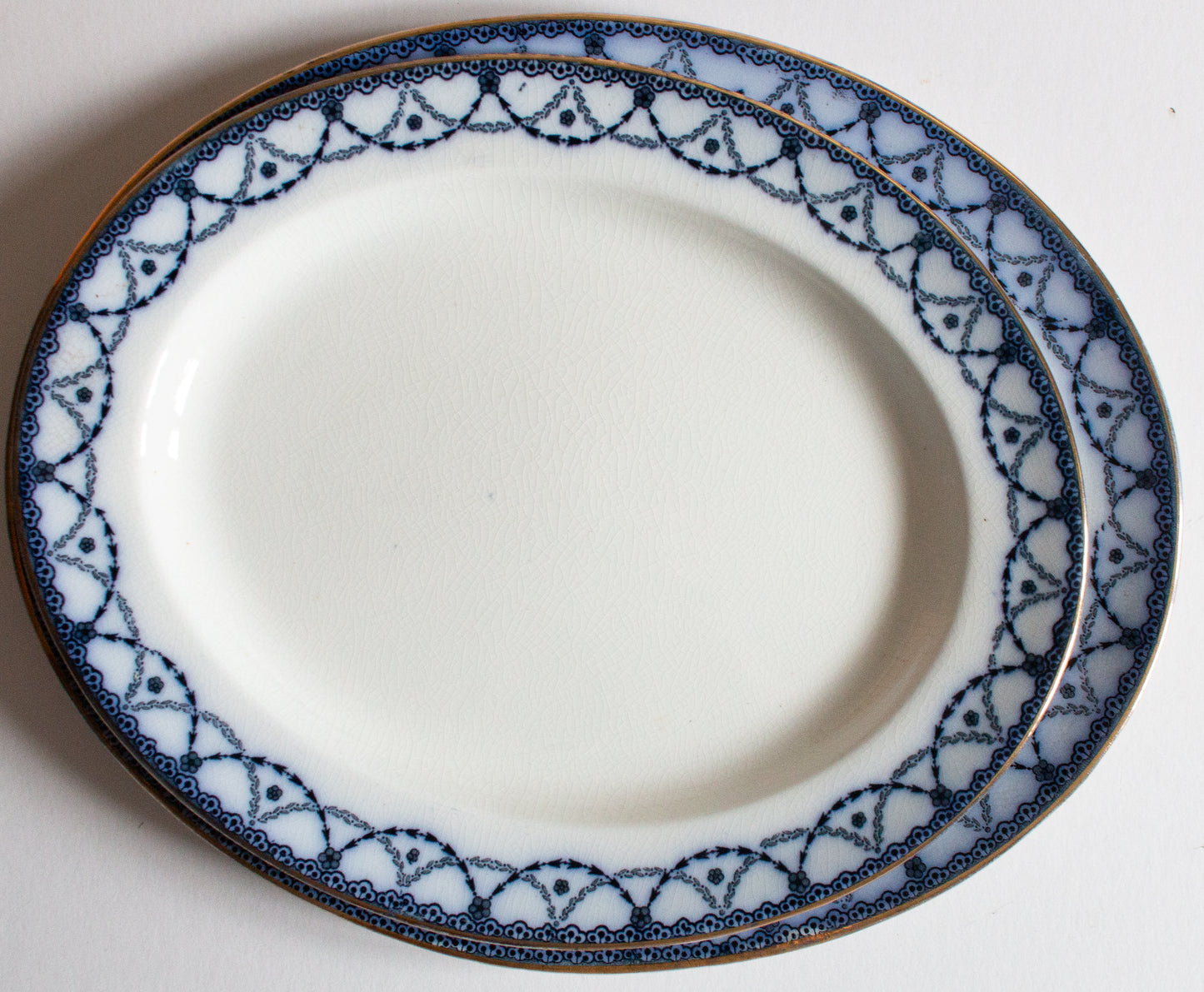 Henry Alcock & Co. Ltd. Semi Porcelain 'Laurel' Pattern Blue and White Transferware Graduated Platters (2)
