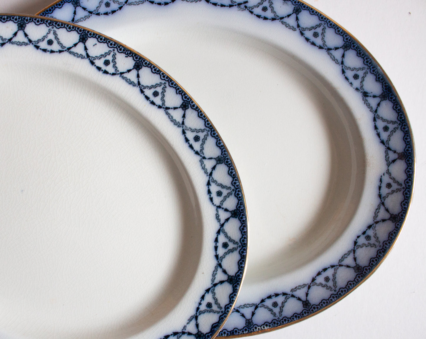 Henry Alcock & Co. Ltd. Semi Porcelain 'Laurel' Pattern Blue and White Transferware Graduated Platters (2)